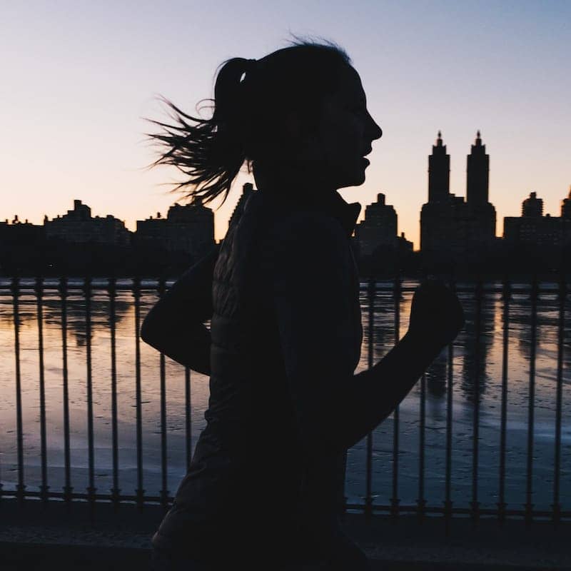 Woman running at twilight